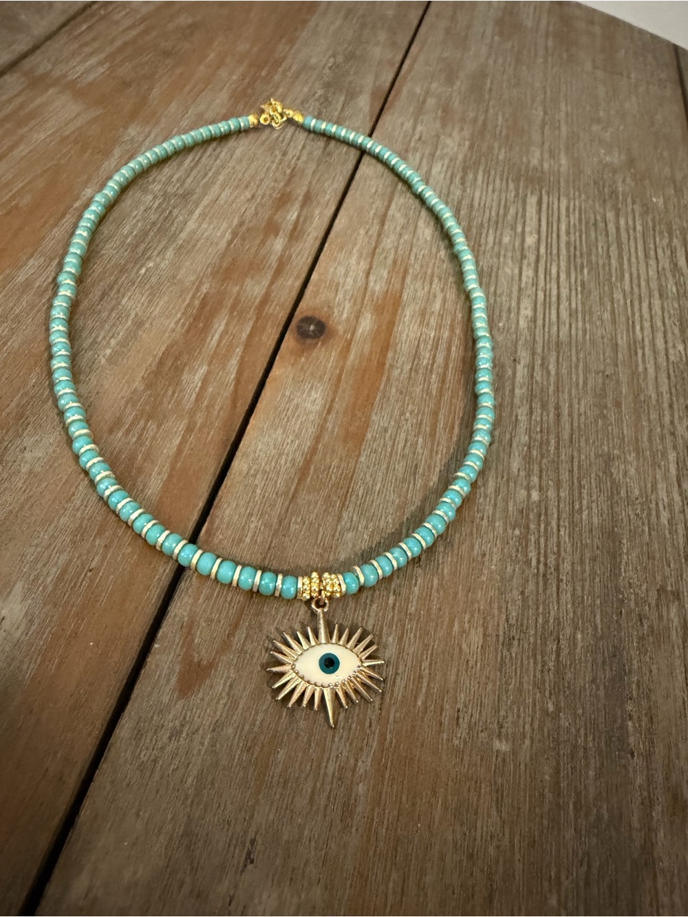 Turquoise Bead Necklace with Gold Sun Eye Pendant